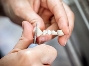 dental-technician-molding-teeth-PR2B5LA (1)