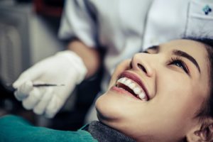 the dentist examines the patients teeth Z6UVVJJ 1